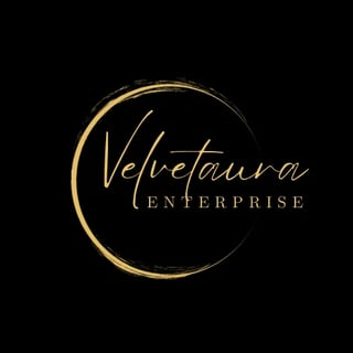 Velvetaura Enterprise logo featuring gold cursive script text inside a circular gold outline on black background